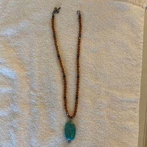 Beaded amber necklace with turquoise stone